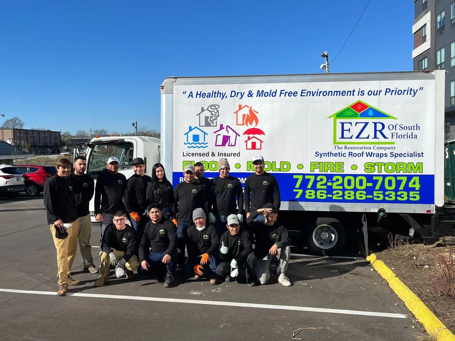 The EZR of South Florida restoration team in front of the company truck